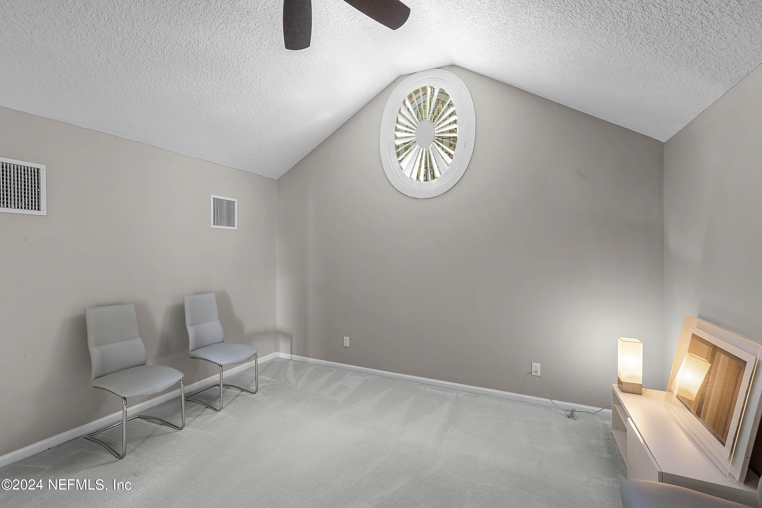 9975 Vineyard Lake Road East Jacksonville, FL 32256 - Photo 34 of 57 a view of a room with furniture and a window