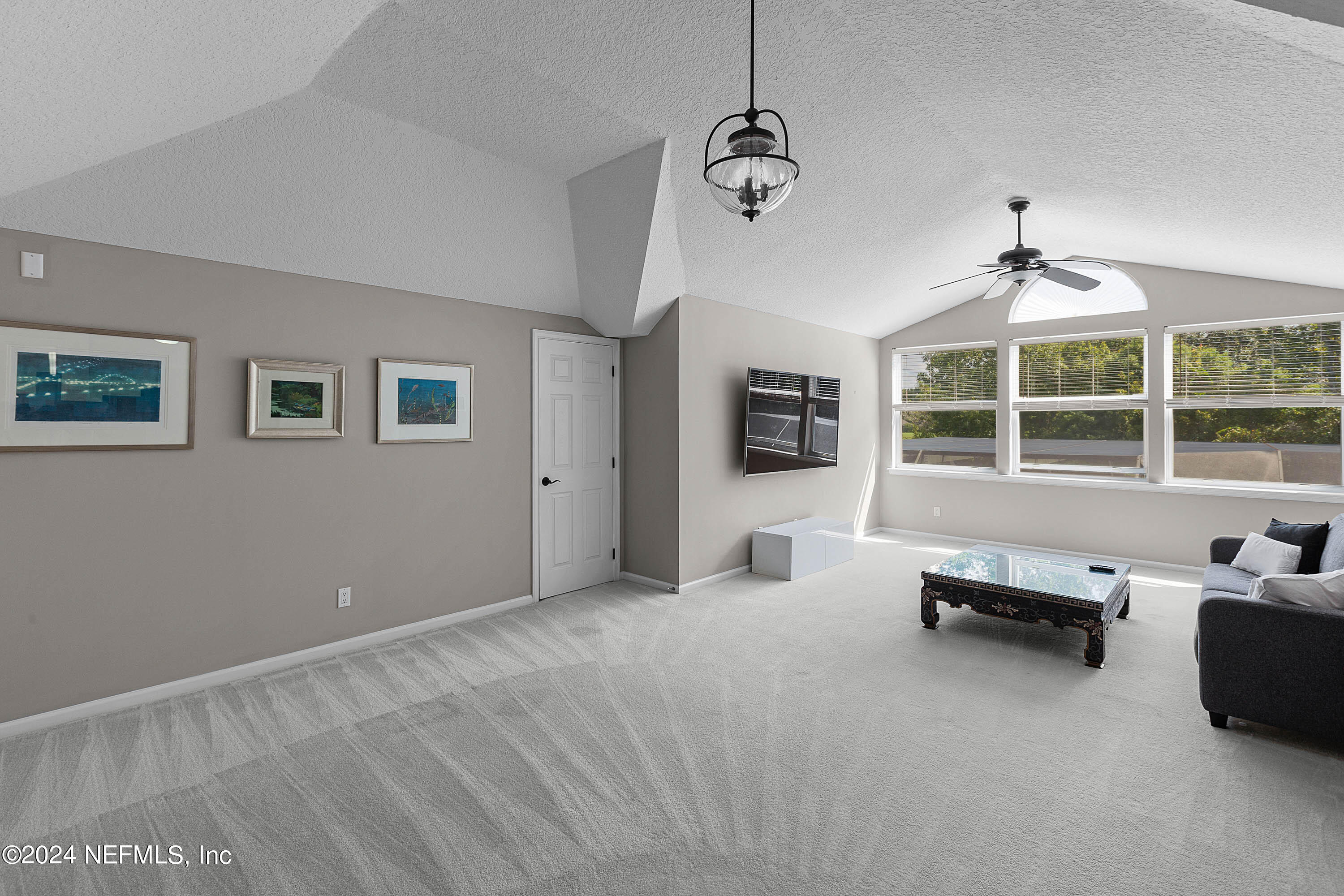 9975 Vineyard Lake Road East Jacksonville, FL 32256 - Photo 36 of 57 a view of a livingroom with furniture and window