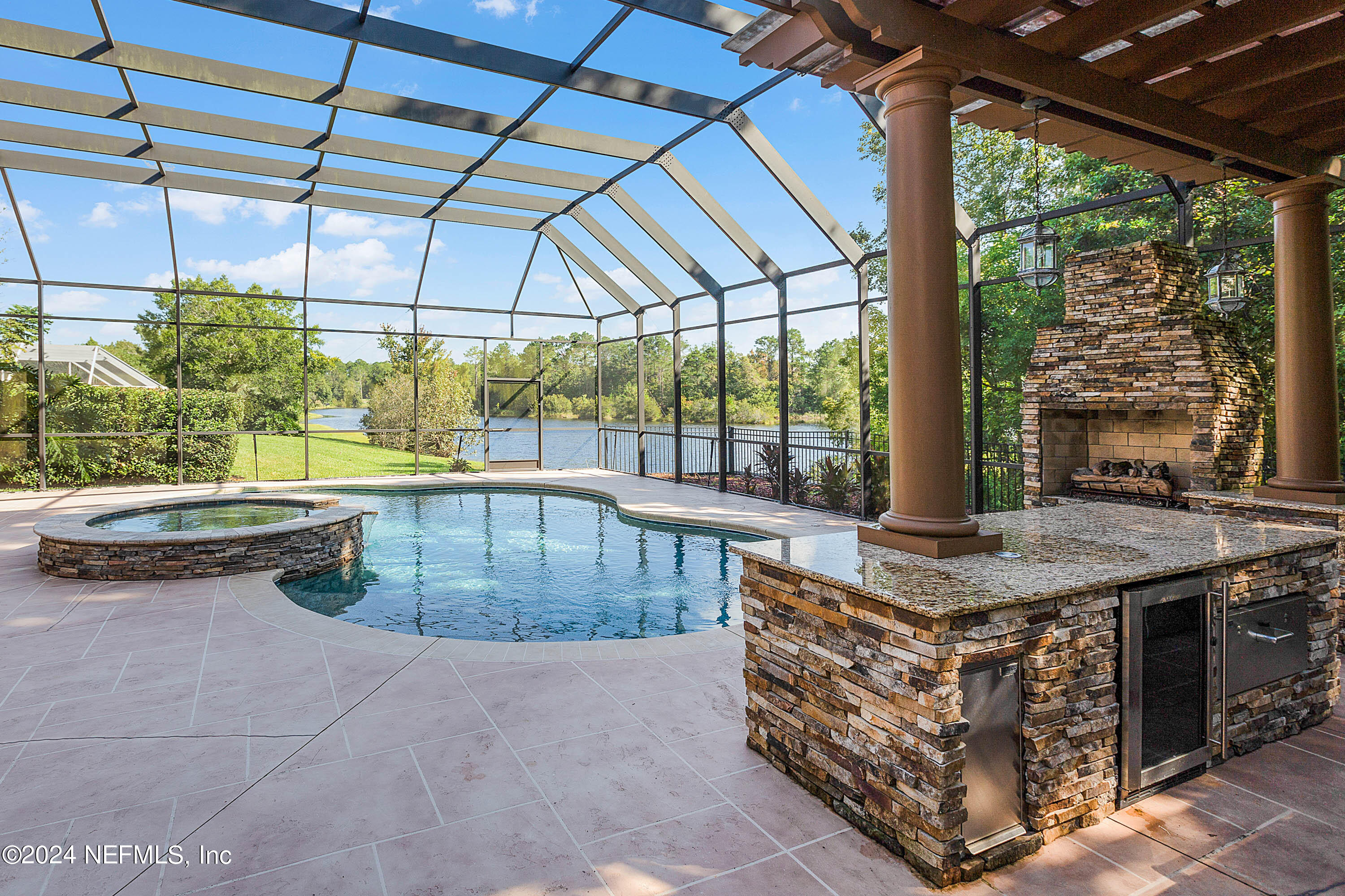 9975 Vineyard Lake Road East Jacksonville, FL 32256 - Photo 40 of 57 a view of a swimming pool with a patio