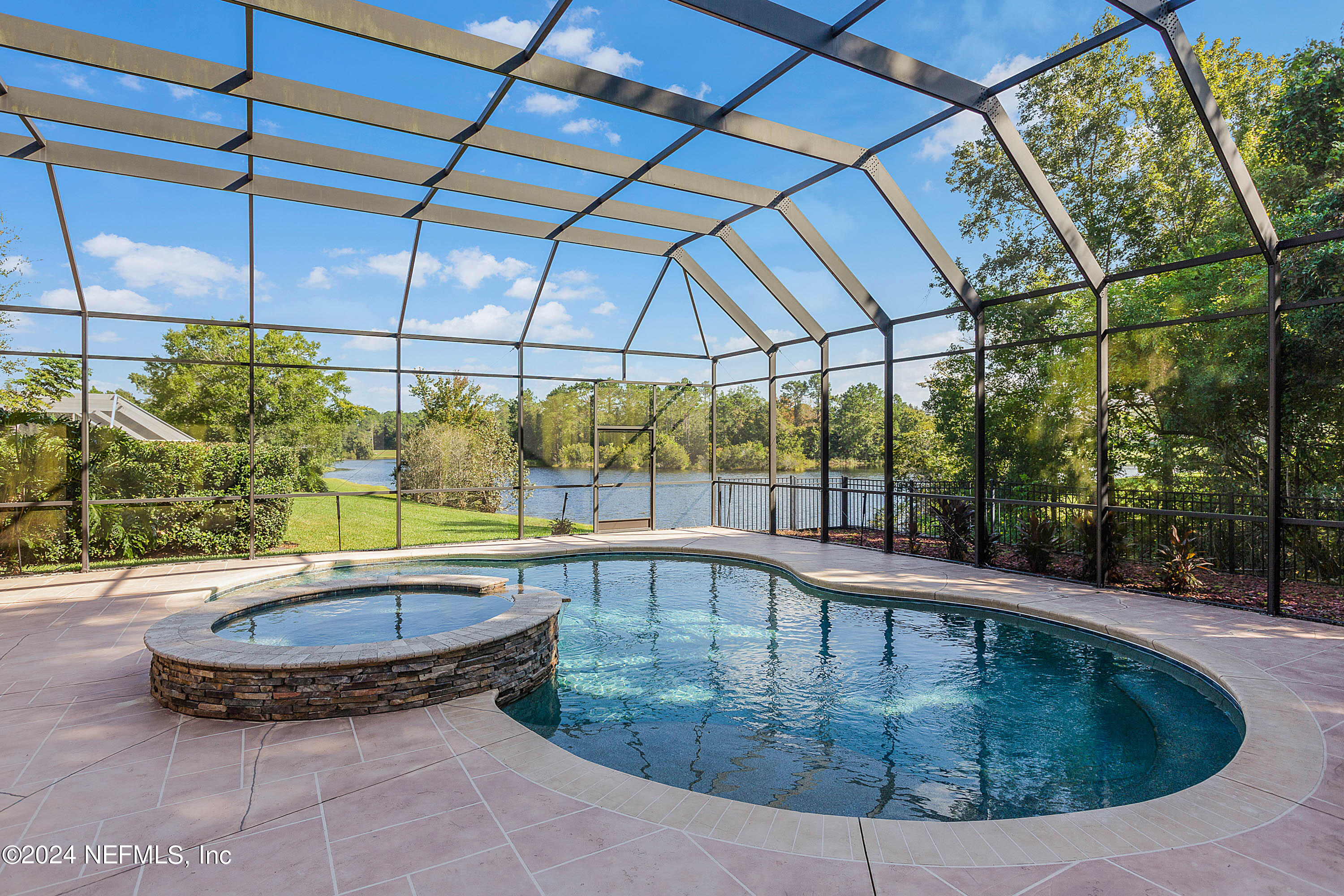 9975 Vineyard Lake Road East Jacksonville, FL 32256 - Photo 41 of 57 a view of a swimming pool with a patio