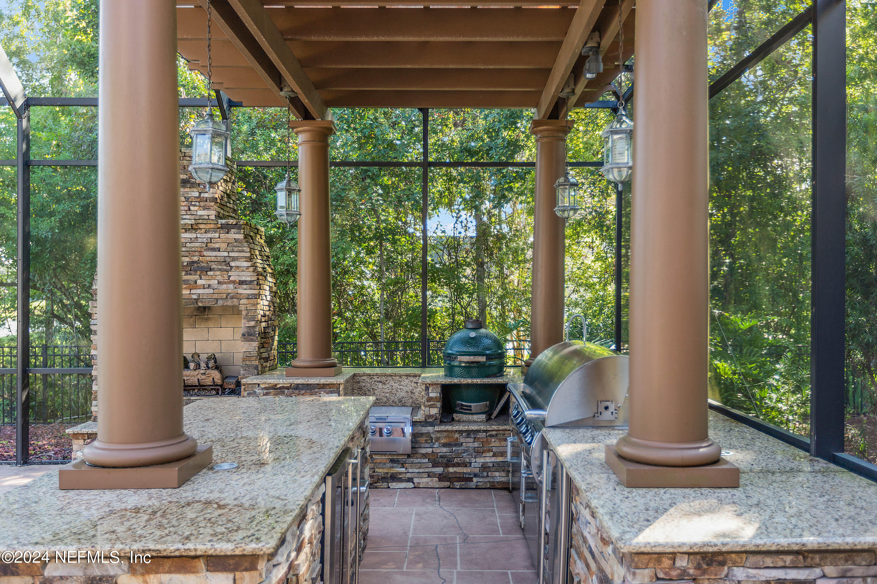 9975 Vineyard Lake Road East Jacksonville, FL 32256 - Photo 42 of 57 a living room with patio furniture and a floor to ceiling window