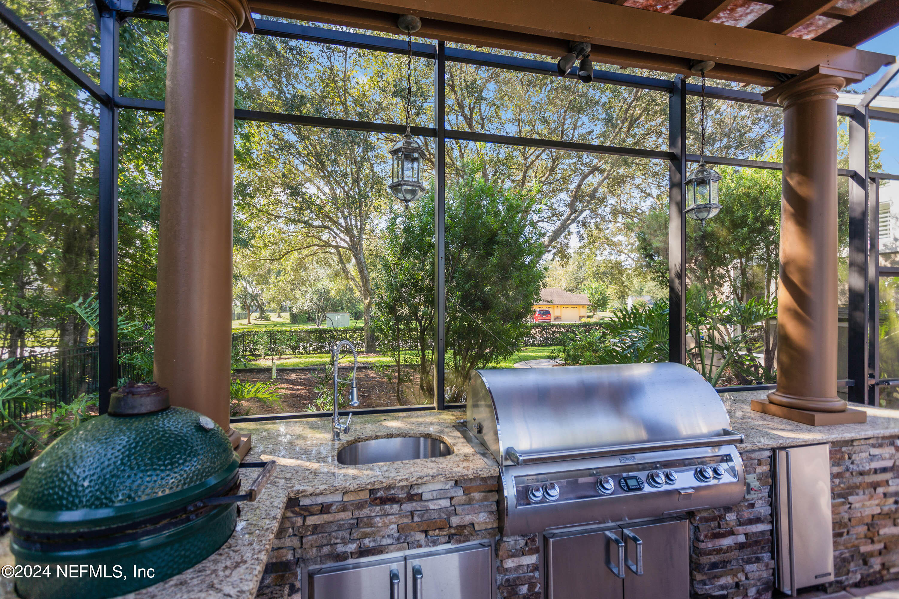 9975 Vineyard Lake Road East Jacksonville, FL 32256 - Photo 43 of 57 a living room with furniture and a floor to ceiling window