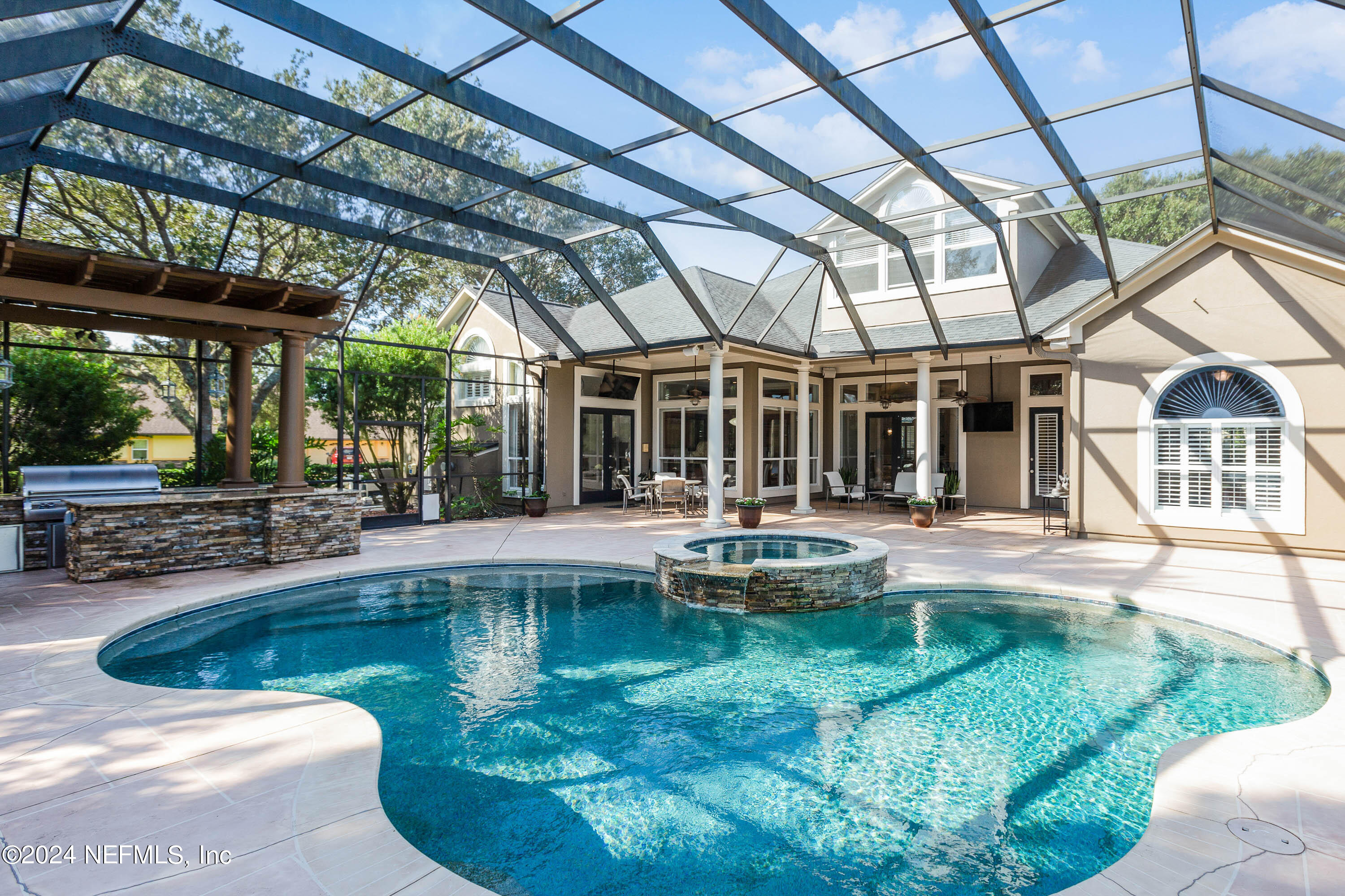 9975 Vineyard Lake Road East Jacksonville, FL 32256 - Photo 46 of 57 a view of a swimming pool with a patio