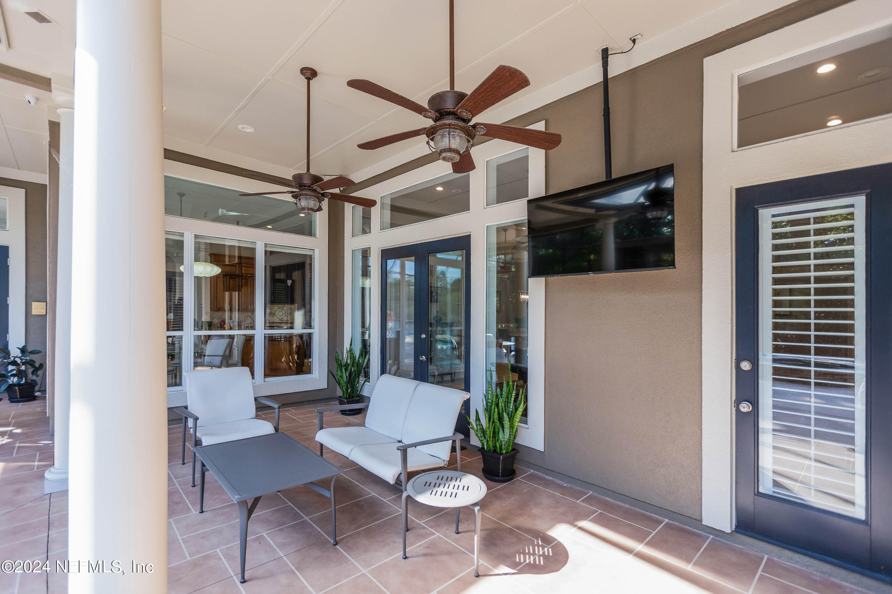 9975 Vineyard Lake Road East Jacksonville, FL 32256 - Photo 47 of 57 a view of a dining room with furniture window and wooden floor