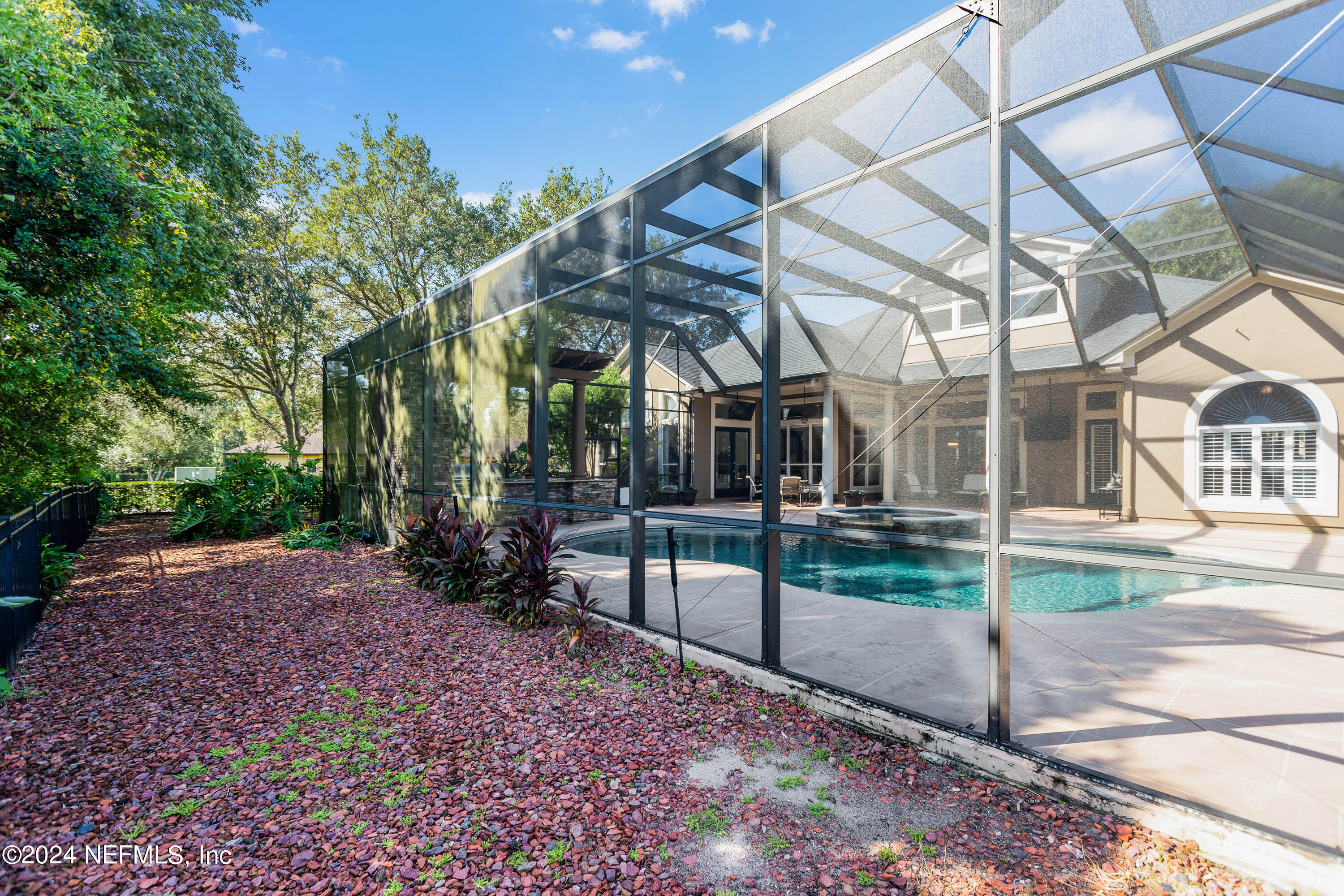 9975 Vineyard Lake Road East Jacksonville, FL 32256 - Photo 50 of 57 a view of a house with a yard