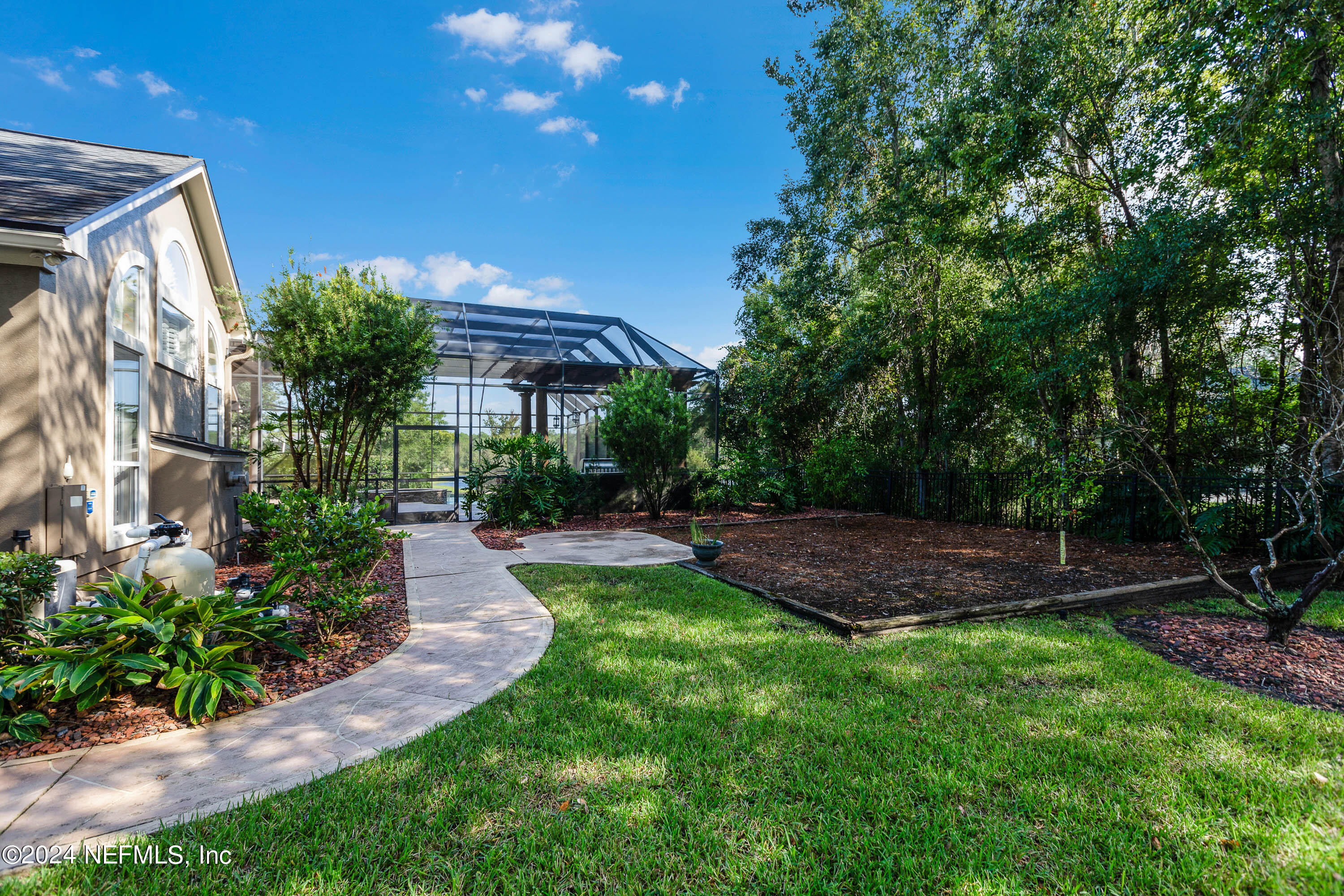9975 Vineyard Lake Road East Jacksonville, FL 32256 - Photo 52 of 57 a front view of a house with a yard