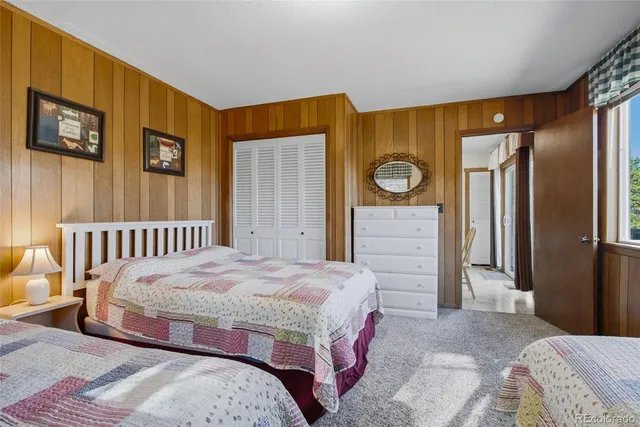 a bedroom with a bed and dresser