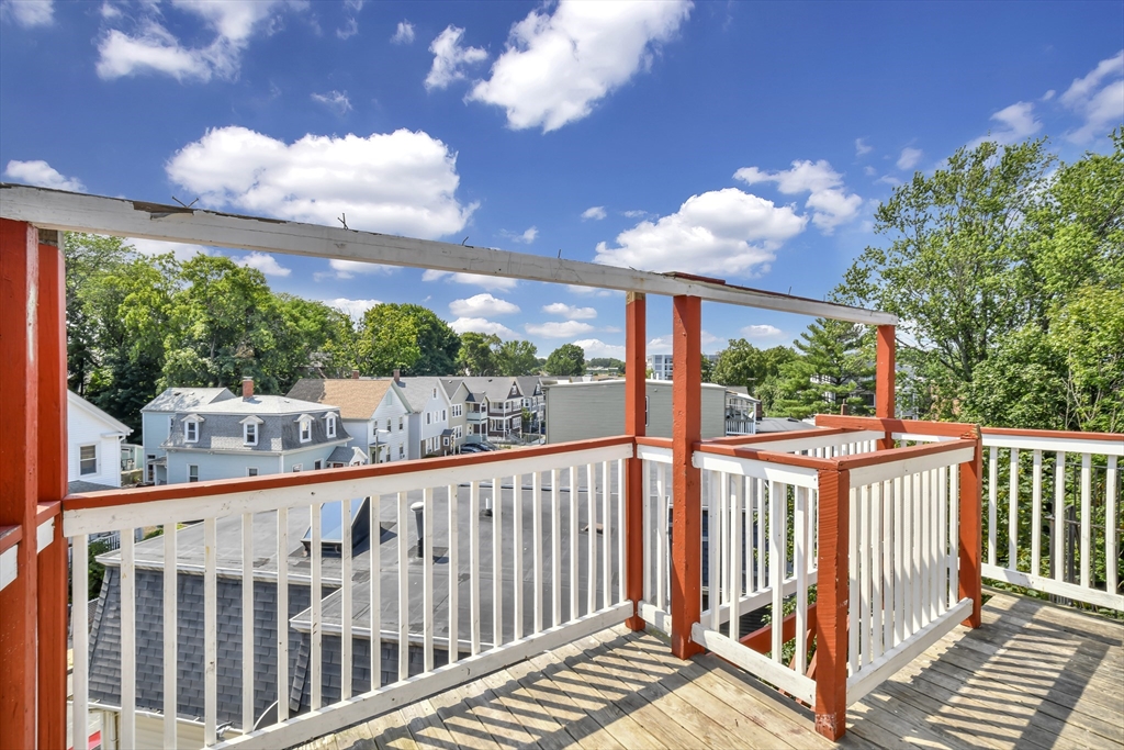 1903 Columbus Avenue Boston, MA 02119 - Photo 10 of 11 a view of a porch with a yard