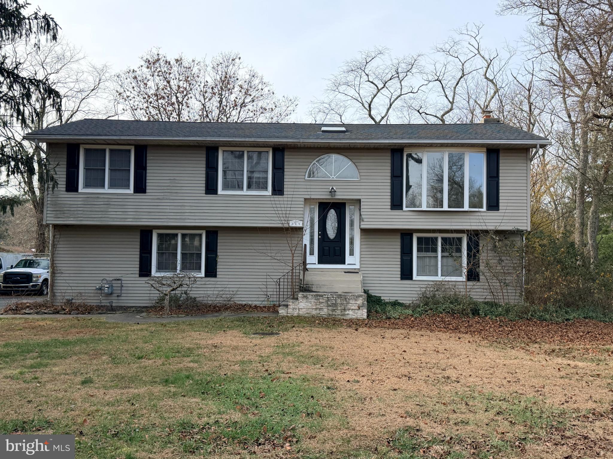 719 Kettle Run Road Marlton, NJ 08053 - Photo 1 of 18 a front view of a house with a garden