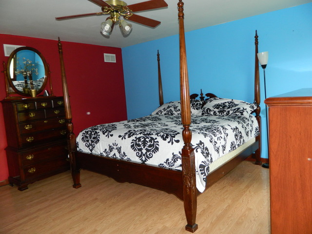 285 Rollin Road Somonauk, IL 60552 - Photo 11 of 25 a bed sitting in a bedroom next to a window