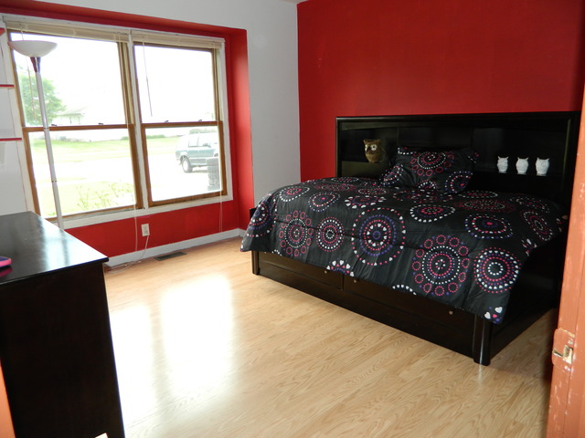 285 Rollin Road Somonauk, IL 60552 - Photo 16 of 25 a bed sitting in a bedroom next to a window