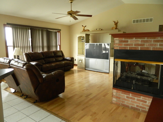 285 Rollin Road Somonauk, IL 60552 - Photo 5 of 25 a living room with furniture and a fireplace