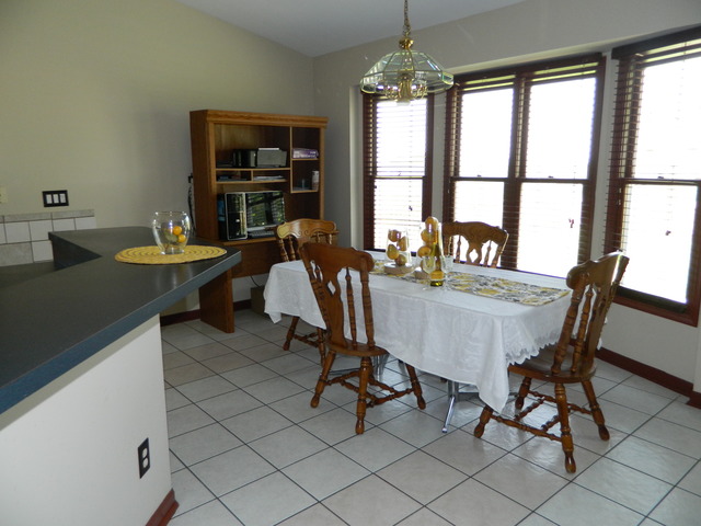 285 Rollin Road Somonauk, IL 60552 - Photo 6 of 25 a view of a dining room with furniture window and outside view