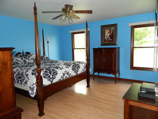 285 Rollin Road Somonauk, IL 60552 - Photo 10 of 25 a bedroom with a bed and a window