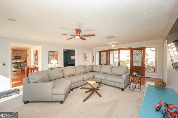 a living room with furniture and a large window