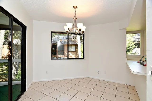 a room with window and white walls
