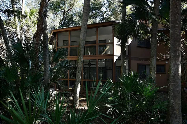 a view of a house with a tree