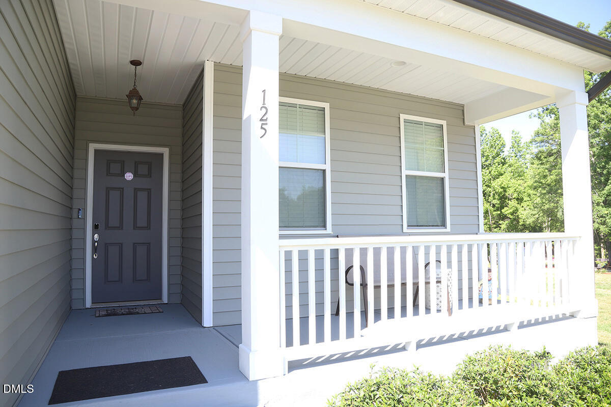 125 Mae Court Roxboro, NC 27573 - Photo 2 of 30 a view of a house with a porch