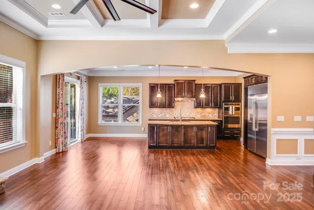 a view of living room with furniture and wooden floor