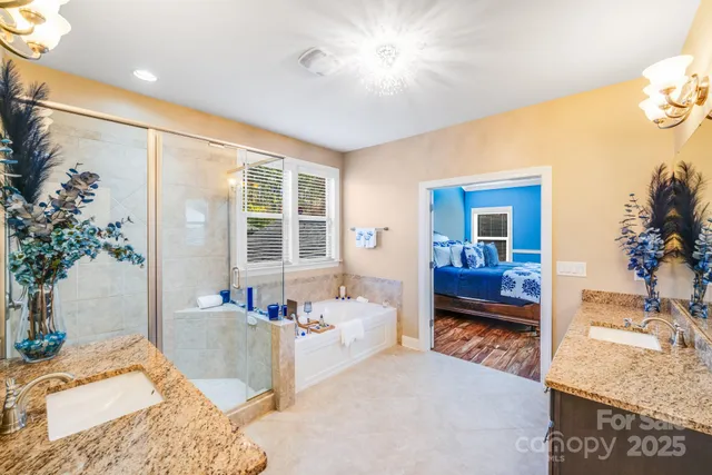 a bedroom with a bed and a potted plant