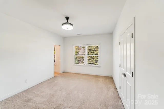 an empty room with a empty space and windows