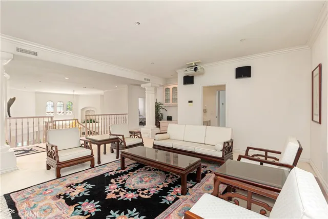 a living room with furniture and a rug