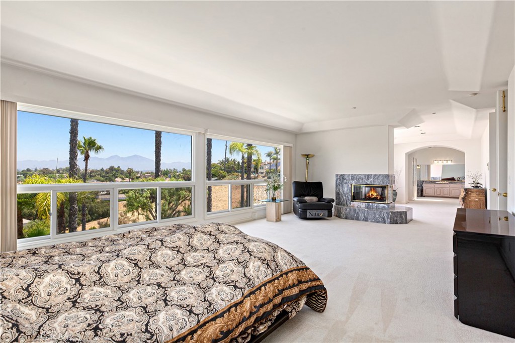25191 Rockridge Road Laguna Hills, CA 92653 - Photo 16 of 33 a bed room with a bed and a large window