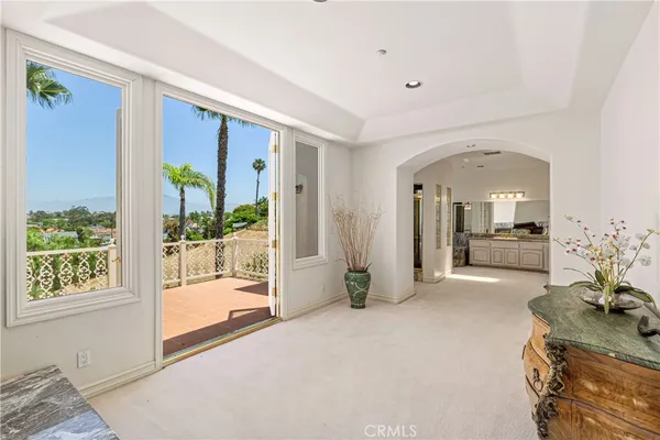 a view of a living room and a balcony