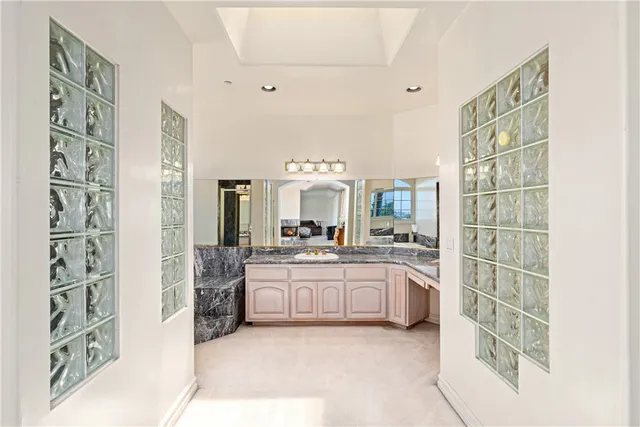 a large bathroom with a double vanity sink and a mirror