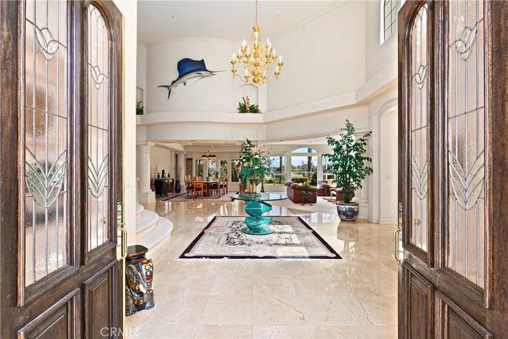 25191 Rockridge Road Laguna Hills, CA 92653 - Photo 2 of 33 a view of living room with furniture and a chandelier