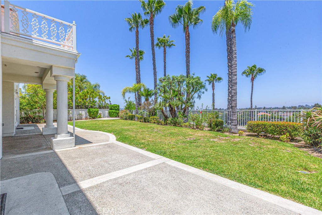 25191 Rockridge Road Laguna Hills, CA 92653 - Photo 21 of 33 a view of a backyard with a garden and palm trees