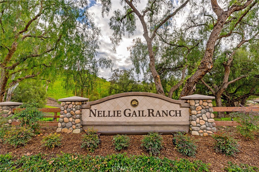 25191 Rockridge Road Laguna Hills, CA 92653 - Photo 24 of 33 a view of outdoor space with sign board and garden