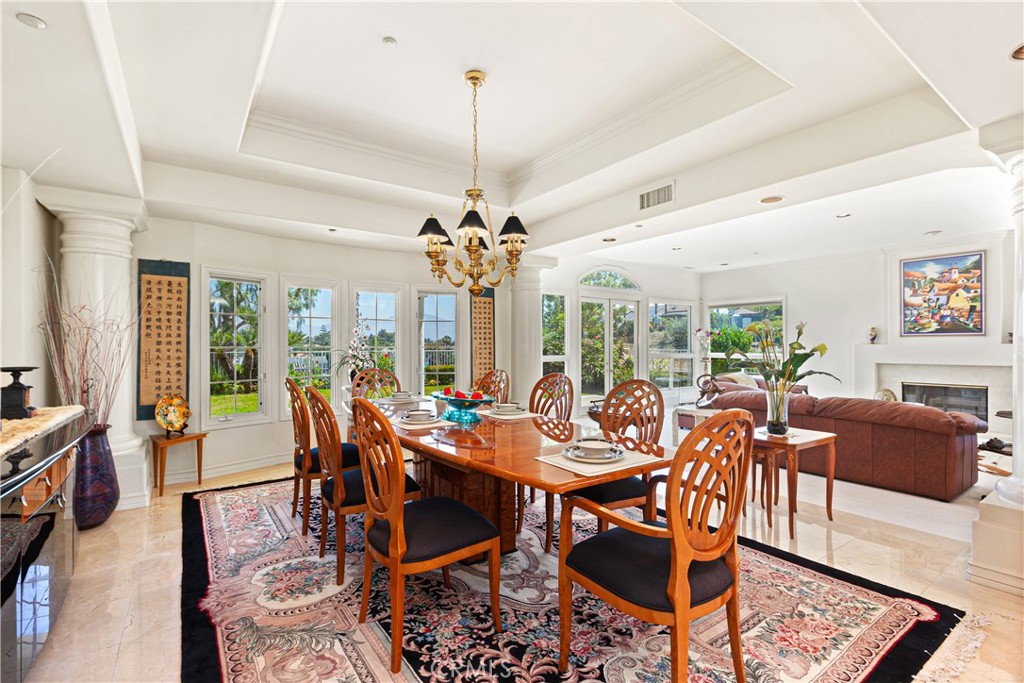 25191 Rockridge Road Laguna Hills, CA 92653 - Photo 10 of 33 a view of a dining room with furniture window and wooden floor