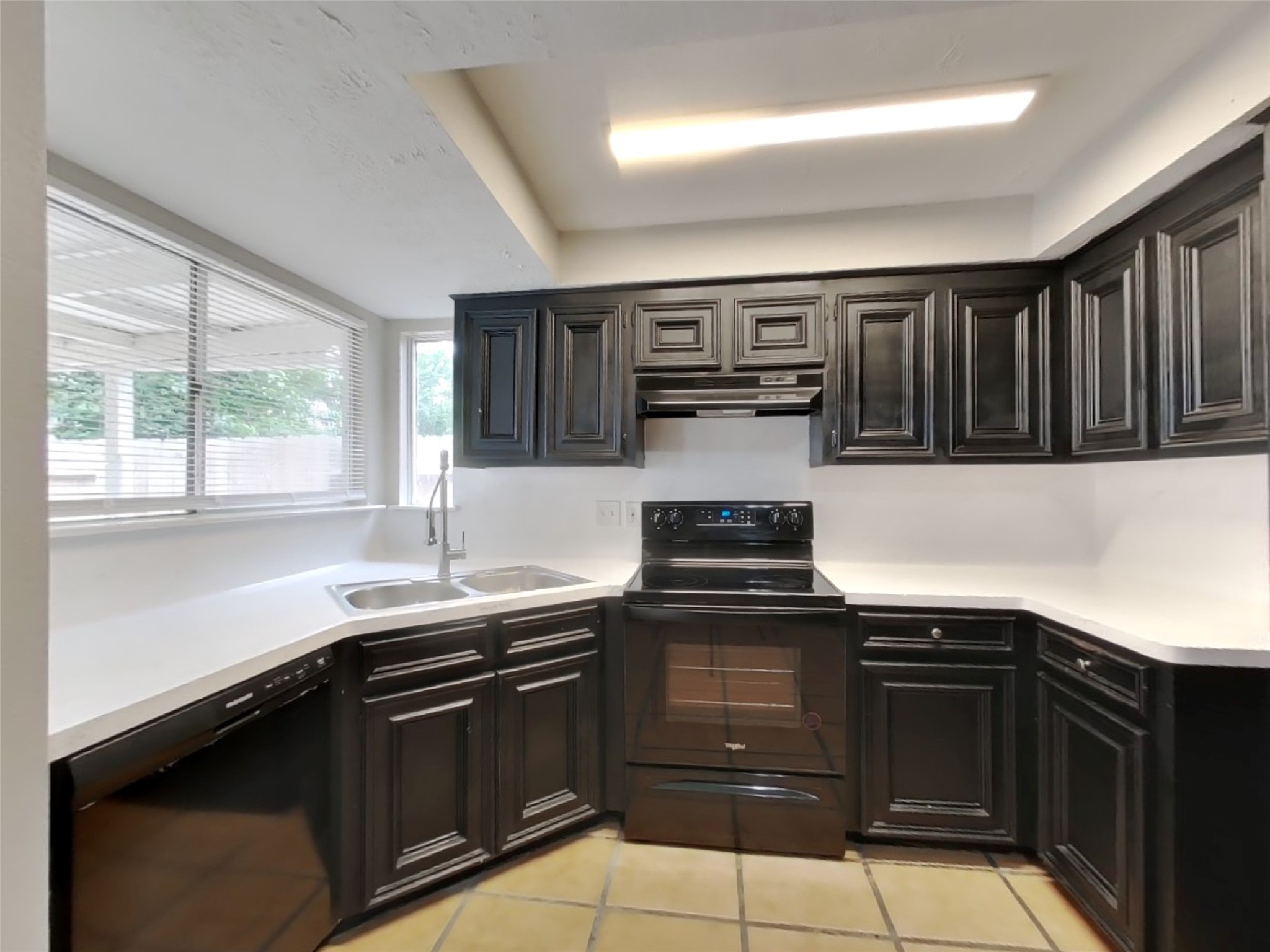 4422 Monteith Drive Spring, TX 77373 - Photo 6 of 18 a kitchen with stainless steel appliances a stove sink and cabinets