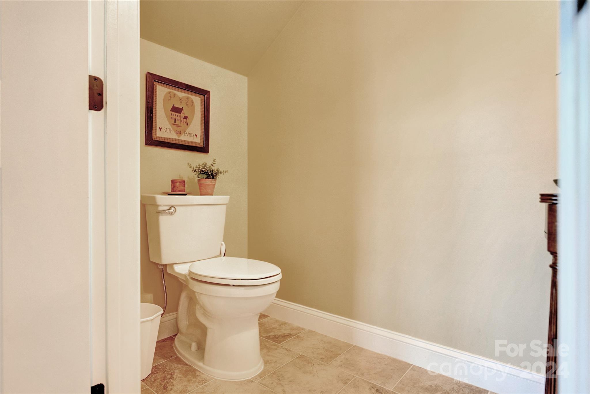 29 Willow Bend Candler, NC 28715 - Photo 29 of 45 a white toilet sitting next to a white sink and vanity