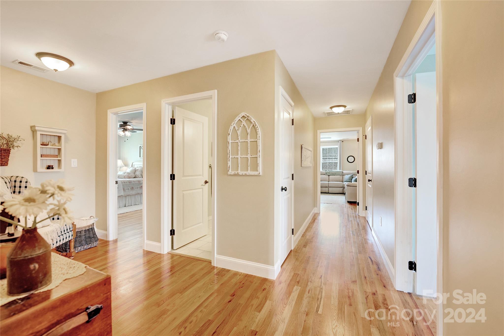 29 Willow Bend Candler, NC 28715 - Photo 32 of 45 a view of a hallway with wooden floor windows and a livingroom