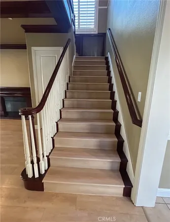 a view of a kitchen with a sink and wooden floor