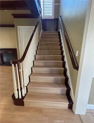 a view of a kitchen with a sink and wooden floor
