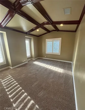 a bathroom with a sink a toilet a mirror and shower