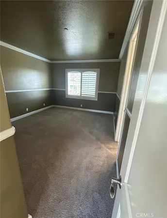 a view of a building with sitting area