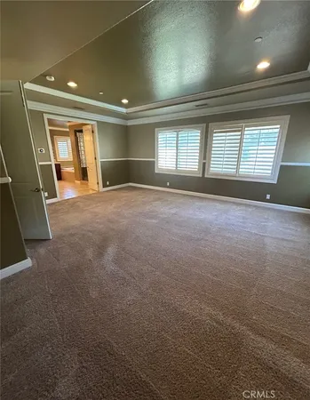 a front view of a house with a large window