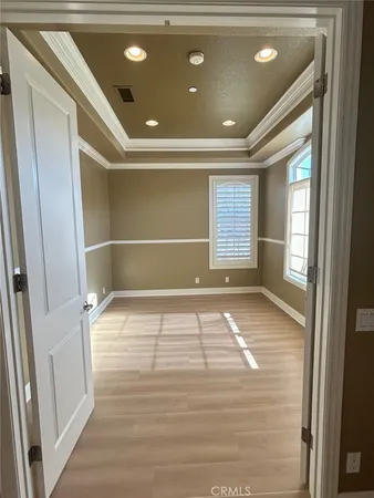a view of empty room with fireplace