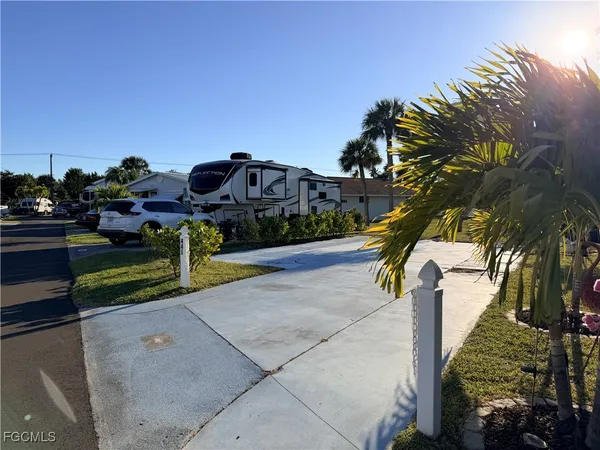 a view of a park with iron fence