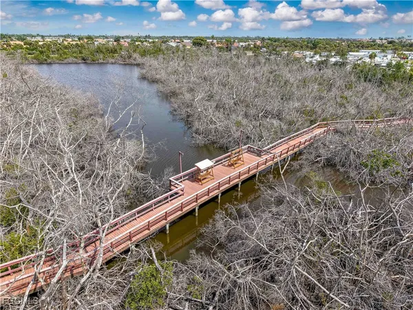 a view of a wooden bridge with lake view