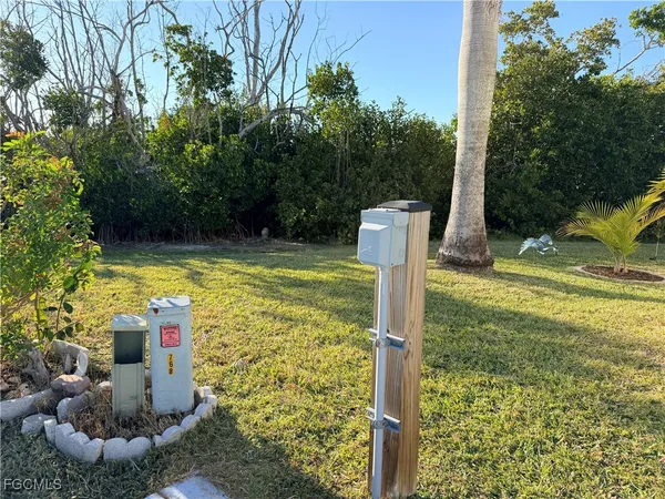 a view of swimming pool with a patio and fire pit