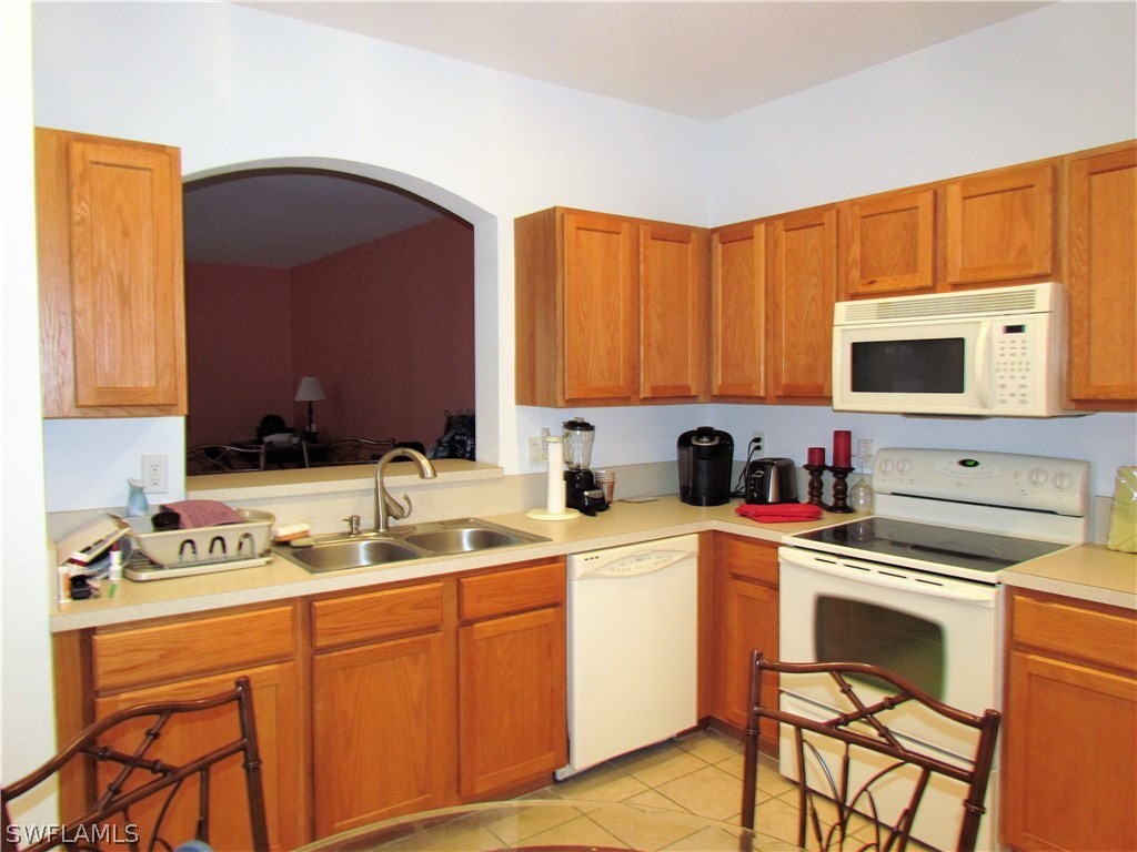 17540 Cherry Ridge Lane Fort Myers, FL 33967 - Photo 8 of 19 a kitchen with a sink cabinets and appliances