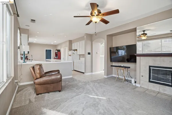 a kitchen with stainless steel appliances granite countertop a refrigerator stove microwave and sink