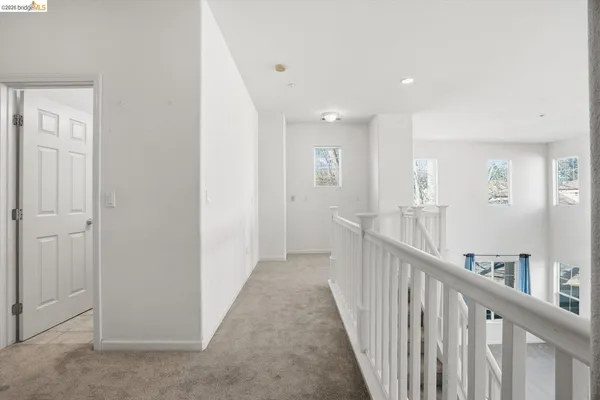 a balcony with wooden floor and furniture