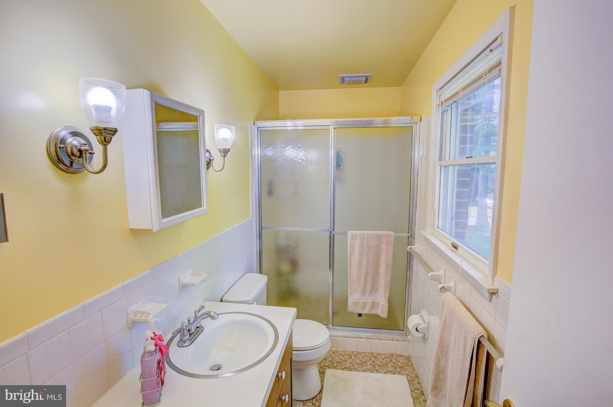 147 Calvert Towne Road Prince Frederick, MD 20678 - Photo 14 of 30 a bathroom with a sink toilet and shower