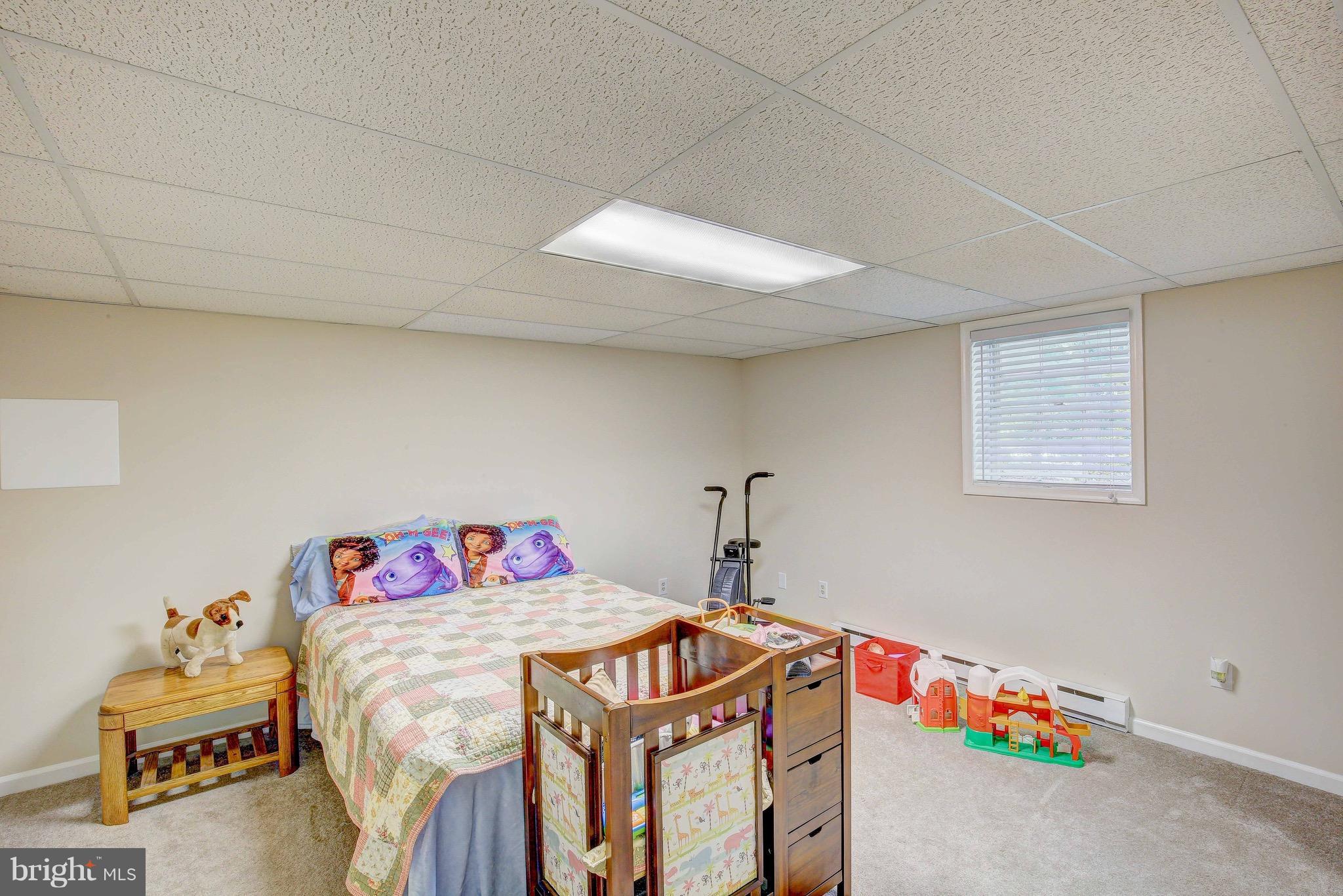 147 Calvert Towne Road Prince Frederick, MD 20678 - Photo 23 of 30 a bedroom with a bed and a window